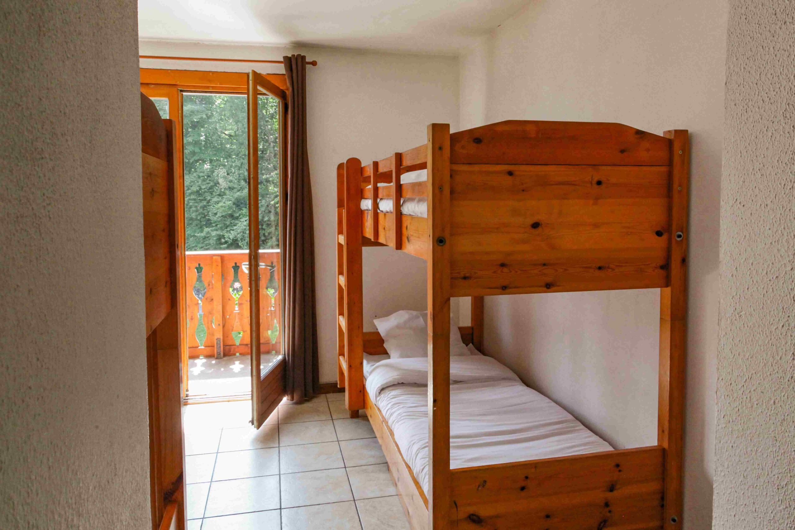 Chambre avec lits superposés au Chalet Le Sauvageon