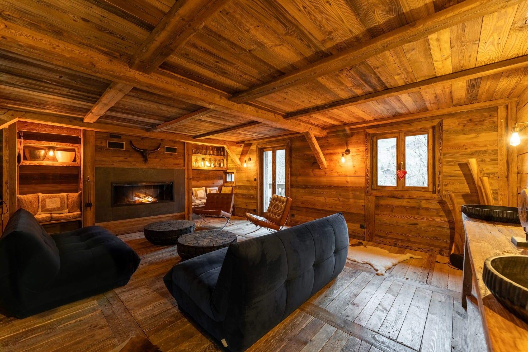 Salon chaleureux des Chalets Champ'Alp