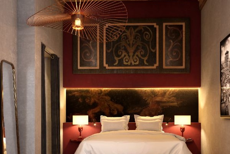 Suite avec décoration chaleureuse et mobilier élégant à La Cour des Loges